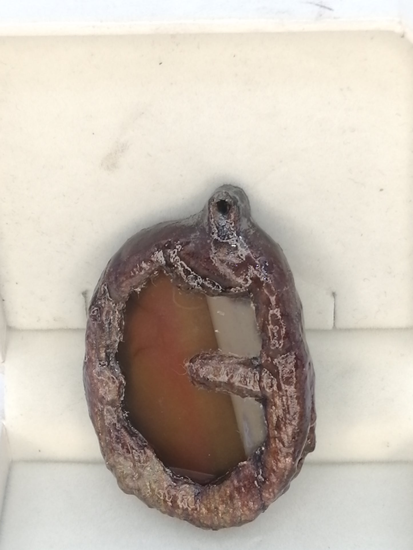 Electroformed copper pendant with enclosed orange agate disc